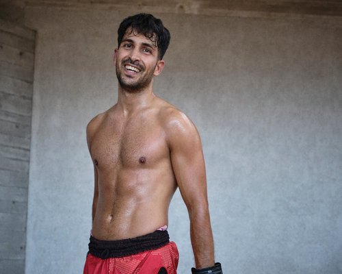 Portrait of gym trainer Carlos, smiling